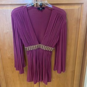 Sky top size med. sleeves have a split underneath arms